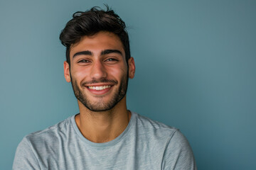 Fototapeta premium A close up portrait of a young man with a subtle smile