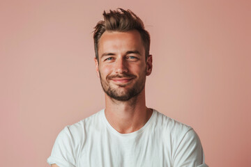 A close up portrait of a young man with a subtle smile