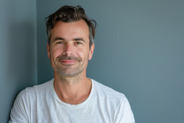 Obraz premium A close up portrait of a young man with a subtle smile