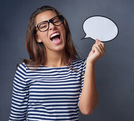 Woman, speech bubble and scream in studio background on glasses for product advertisement, promotion and fashion. Girl, shouting and portrait with sign board for clothes, sale and mockup space