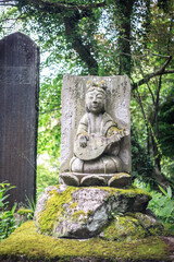 Mystical Stone Carving Amidst Verdant Forest