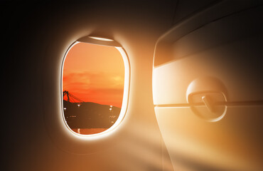 Airplane window in the air high above sunset sky,Inside Passenger plane POV looking out at...