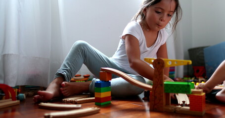Children playing with toys, little sister and toddler