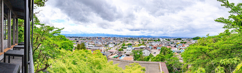 Fototapeta premium Panorama View from Iimori Mountain: Aizuwakamatsu’s Urban and Natural Harmony, Japan