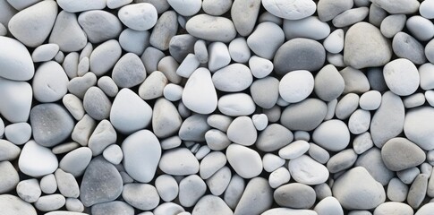 white stone texture as a background a row of white stones arranged in a row from left to right, with a small white stone on the left and a larger white stone on the right