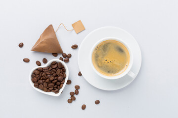 Cup of coffee on concrete background, top view