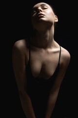 Sexy Woman silhouette in the dark. Beautiful Body Brunette Girl