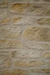 Mur extérieur enduit façon pierre. Texture pierre, roche, propre et clair.