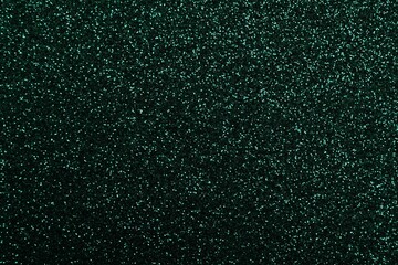 Shiny dark green glitter as background, closeup