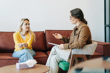 Psychological counseling scene.  A psychologist conducts a session with a patient in the office.