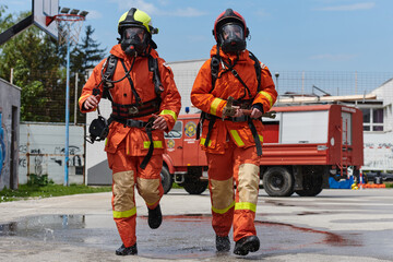 Firefighter Team Training with Various Tools in Professional Gear