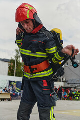 Obraz premium Professional Firefighter Suits Up in Full Gear for Duty
