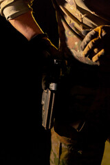 close-up at a professional shooting range military weapons trainer standing preparing to use a...