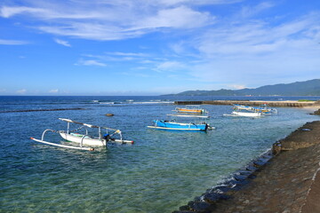 Obraz premium Beautiful sea view. Fishing boats anchored on the shore. Candidasa, Karangasem Bali
