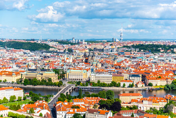 Overlooking the historic Prague Old Town, the Vltava River winds through, with distinct Zizkov...