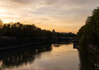 Rome, Italy - April 11, 2024: Rome, Italy - April 11, 2024: Views of the Tiber River as it passes...