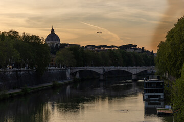 Rome, Italy - April 11, 2024: Rome, Italy - April 11, 2024: Views of the Tiber River as it passes...