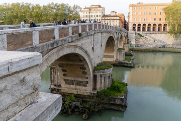 Rome, Italy - April 11, 2024: Rome, Italy - April 11, 2024: Views of the Tiber River as it passes...