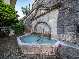 Historical stone fountain in Regensberg, Switzerland