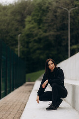 Fitness, sports and woman doing a stretching her arms before a workout or training outdoor in nature. Health, wellness and girl athlete doing a warm up exercise for her muscles, joints and body.