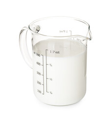 Fresh milk in measuring cup isolated on white
