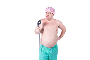 Funny fat man washes himself in the shower. White background.