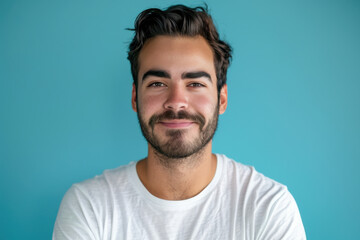 Fototapeta premium A close up portrait of a young man with a subtle smile