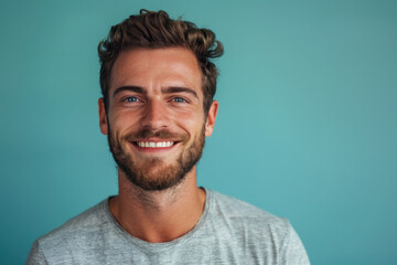 A close up portrait of a young man with a subtle smile