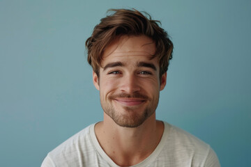 Fototapeta premium A close up portrait of a young man with a subtle smile