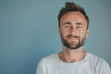 Fototapeta premium A close up portrait of a young man with a subtle smile