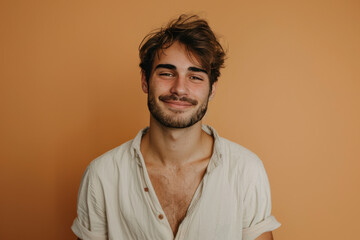 Obraz premium A close up portrait of a young man with a subtle smile
