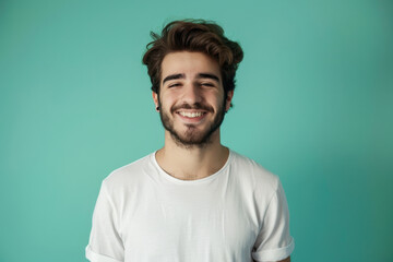 A close up portrait of a young man with a subtle smile