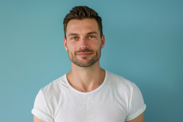 Fototapeta premium A close up portrait of a young man with a subtle smile