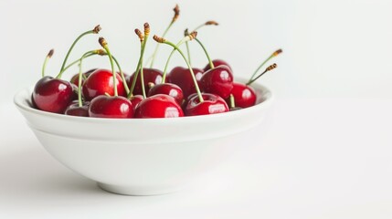 Fresh cherry berries in a bowl on a white background. The concept of a healthy diet and support for local producers. Close-up.