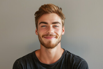 Fototapeta premium A close up portrait of a young man with a subtle smile