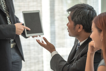 secretary present a document to boss to reading. coworker explain statistics, Hand finger point to...