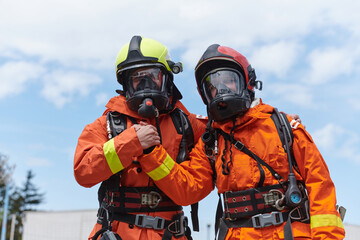 A unified team of firefighters, adorned in their uniforms, engages in a heartfelt celebration...