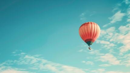 Obraz premium A lone balloon, its surface adorned with a captivating artwork, drifting serenely across a vast expanse of azure sky.