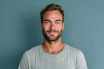 Fototapeta premium A close up portrait of a young man with a subtle smile