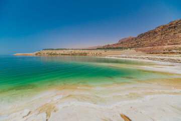 Captivating view panorama of the tranquil Dead Sea against a clear sky, showcasing Jordan's unique natural beauty and mineralrich landscapes in Jordan