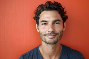 Fototapeta premium A close up portrait of a young man with a subtle smile