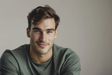 Obraz premium A close up portrait of a young man with a subtle smile