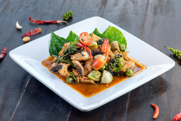 Pad kra pao is a popular Thai stir-fried dish with minced meat, vegetables and Thai basil leaves.