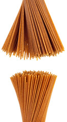 Uncooked whole grain spaghetti isolated on a white background. Raw pasta.