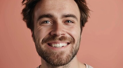Obraz premium joyful portrait of smiling man with bright smile and happy eyes positive emotion concept