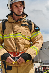 A firefighter dons the essential components of their professional gear, embodying resilience, commitment, and readiness as they gear up for a hazardous firefighting mission, a testament to their