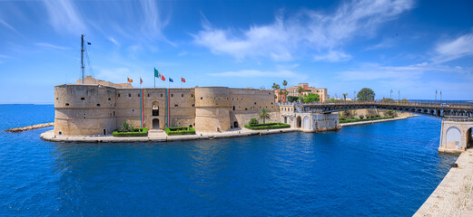 Taranto cityscape: iconic view with Aragonese Castle and Ponte Girevole (Swing Bridge) in Apulia,...