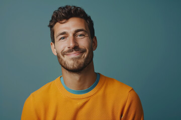 Obraz premium A close up portrait of a young man with a subtle smile