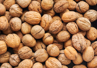 Top view of whole walnuts as background texture