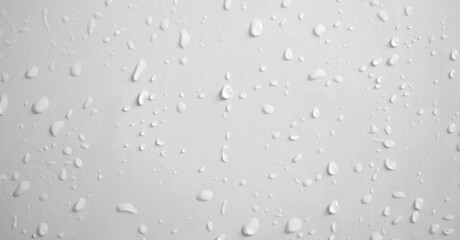Water drops on white wall background texture
